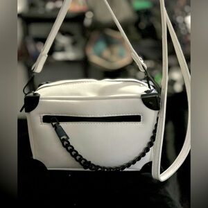 FOXBLOOD X BAM FOREVER White crossbody bag with black metal details.